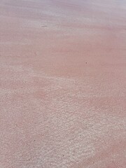 Fototapeta premium Stunning pink salt flats texture creating vibrant abstract pattern for modern design projects and unique backgrounds. Komodo National Park, Indonesia