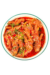 Spicy Chicken Feet in Red Chili Sauce with Herbs and Sesame Seeds on White Background
