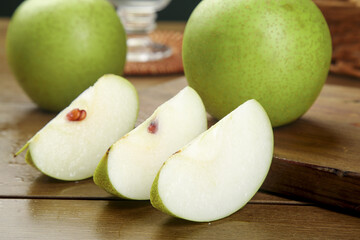 Fresh Green Pears Sliced on Wooden Cutting Board - Healthy Fruit Food Photography
