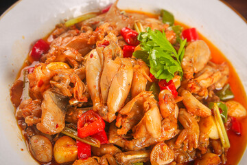 Spicy Stir-Fried Frog Legs with Fresh Vegetables and Red Peppers - Traditional Asian Cuisine