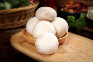 Fresh White Button Mushrooms in Wooden Bowl on Cutting Board - Healthy Vegetarian Cooking Ingredients