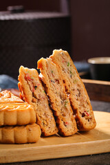 Traditional Five-Kernel Mooncakes Sliced Showing Coarse Grain Filling - Chinese Mid-Autumn Festival Pastry