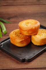 Traditional Chinese Mooncakes for Mid-Autumn Festival Celebration on Wooden Background