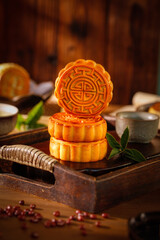 Traditional Chinese Mooncakes with Lotus Seed Red Bean Paste on Wooden Base for Mid-Autumn Festival Celebration