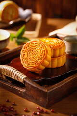Traditional Chinese Mooncakes on Wooden Tray for Mid-Autumn Festival Celebration