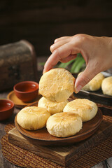 Traditional Mooncakes on Wooden Plate for Mid-Autumn Festival Celebration and Family Reunion