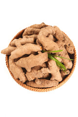 Fresh Ginger Root Sliced in Wicker Basket with Green Leaves - Organic Cooking Ingredient