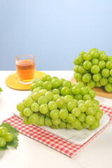 Fresh Green Grapes and Tea Glass Healthy Food Styling with Natural Sunshine Lighting