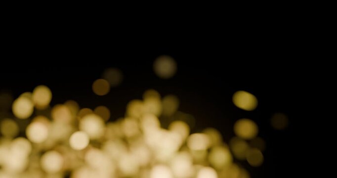 Anima&ccedil;&atilde;o 4K de bokeh dourado sobre fundo preto, com brilho suave e loop cont&iacute;nuo. Visual elegante e cinematogr&aacute;fico