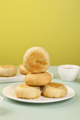 Traditional Chinese Mooncakes with Nut Filling Stacked on Plate for Mid-Autumn Festival Celebration