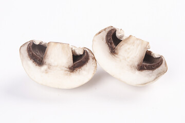Fototapeta premium Fresh Sliced Mushrooms on White Background Studio Photography