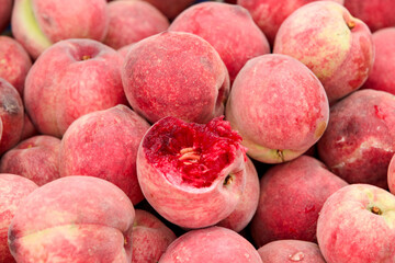 Fresh Red-Fleshed Peaches Stacked with Blood Red Interior Showing Natural Fruit Quality