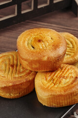 Traditional Handmade Golden Mooncakes for Mid-Autumn Festival Chinese Cultural Celebration