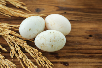 Fresh Duck Eggs on Rustic Wood with Wheat - Farmhouse Kitchen Organic Produce
