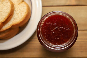 A top view of of a jar of strawberry jelly