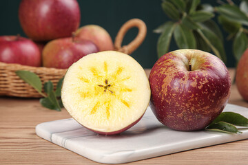 Fresh Xinjiang Yanyuan Apples with Heart-Shaped Core on Marble Board