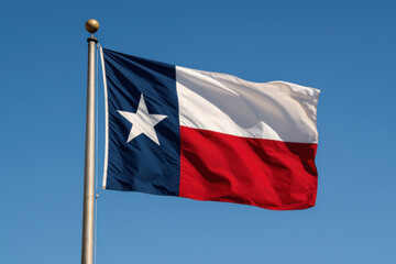 Texas state flag waving under a clear blue sky

Iconic Lone Star Flag of Texas on a flagpole

Symbol of Texas pride and independence in the wind

Red, white, and blue Texas flag flying outdoors