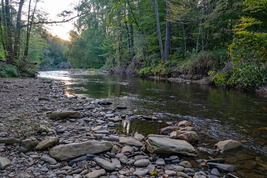 The Davidson River in North Carolina&rsquo;s Pisgah National Forest at dusk.