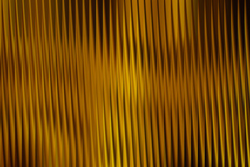 Obraz premium Illustration of golden abstract background with vertical lines and wavy patterns, creating a visually appealing design