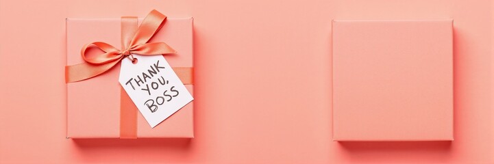 Gift box with "Thank you Boss" tag on pastel background  
