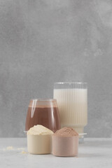 Nutritious protein powder with chocolate and vanilla flavor. Sports nutrition.