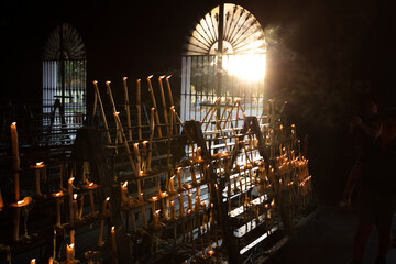 El Rocio, Sevilla, Andalusia, Spain. 28 August 2025. Elderly woman lighting candles