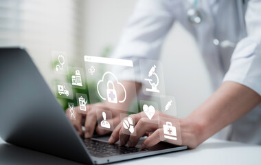 Doctor using laptop with digital healthcare icons, cloud storage, data security and telemedicine technology concept for modern medical services and online patient care