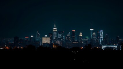 A city skyline illuminated at night with long exposure and deep blue tones.
