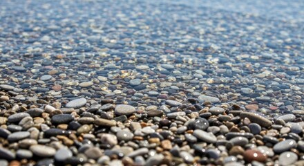Clear shallow water over a beach of small stones