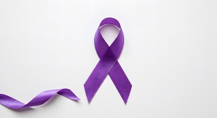 Close-up of a purple satin ribbon loop, a symbol for various health and social causes, isolated on a white surface with copy space