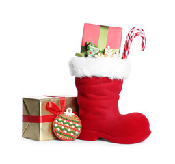 Happy Saint Nicholas day. Red boot with sweets and gift boxes isolated on white