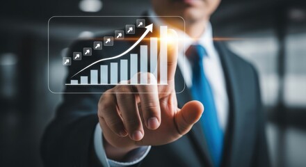 Businessman touching a rising graph on a futuristic screen, symbolizing growth and success