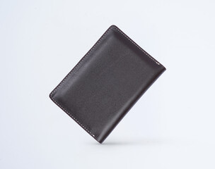Genuine leather fashionable black wallet for men's isolated on a white background. A professional and stylish look. top view of black leather wallet. banknotes and put card inside the wallet