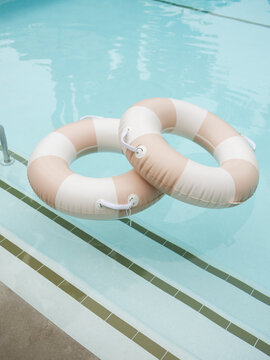 Pool Floaties Rest in a Tranquil Swimming Pool 