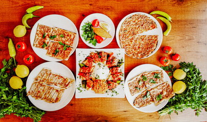 Delicious meat kebab with fresh vegetable salad served with variety of Turkish dishes and...