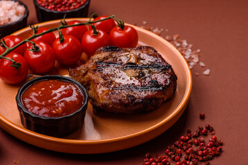 Steak, beef or pork on the bone, meat cooked on the grill with rosemary. Steak on the bone