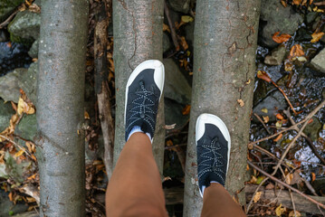 Woman legs with barefoot hiking shoes in the  mountain