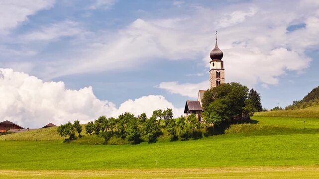Chiesa di San Valentino in Seiser Alm and Alpe di Siusi, Dolomites, aerial view. Rural church on the South Tyrol alpine plateau