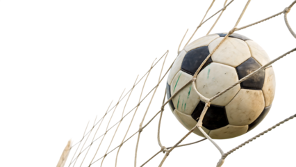 Soccer ball nestled in the goal net against a solid background cut out on PNG. AI GENERATED.