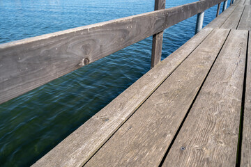 Lake with wooden pier in summer 