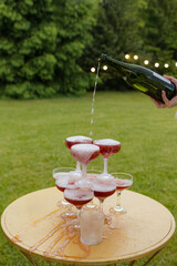 Celebration in the garden with sparkling drinks in beautiful glasses on a sunny afternoon
