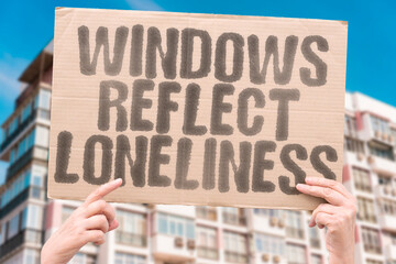 “Windows  Reflect  Loneliness”  Looking out while feeling inside — a mirrored solitude.  
WINDOWS. REFLECTION. LONELINESS. ISOLATION. URBAN. SPACE.