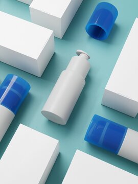 White and blue cosmetic bottles with packaging on blue background