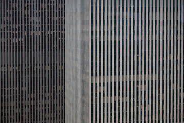 Close-up facade of Manhattan skyscrapers with vertical lines