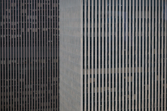 Close-up facade of Manhattan skyscrapers with vertical lines