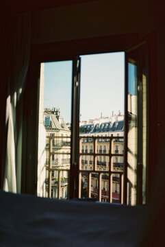 View of classic Parisian buildings through window
