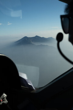 Mountain Peak Seen from Aircraft Cockpit in Morning Haze