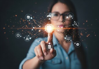 Womans finger touching a glowing digital network of icons representing technology and data