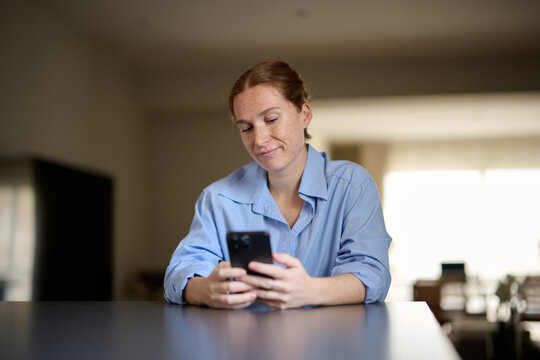 Woman texting a message with her Smartphone