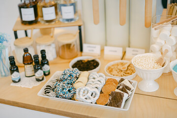 Sweet treats on display at a dessert table in a cozy cafe during a weekend afternoon
